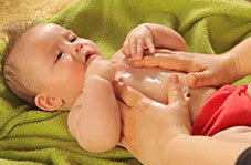 How does massage oils help in improving the health of a baby