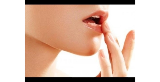 How do lip creams help in treating dark lips?